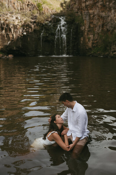 couple touching glasses of champagne