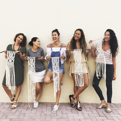 Isabella's students showing their macrame after live workshop in Dubai