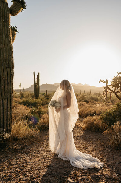 bride with hat and bouquet