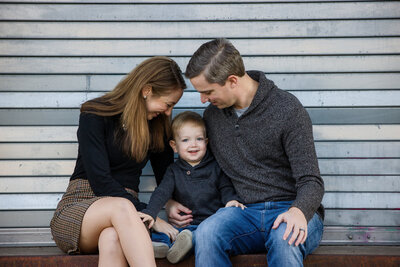A cheerful family sharing a special moment together during a spring mini session in Phoenixville, perfect for family photography.