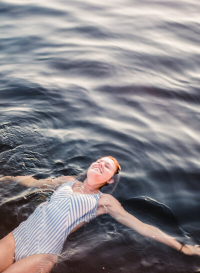 women floating in the lake in madison wisconsin brand photographer