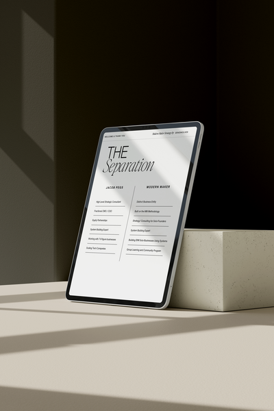 iPad mockup showcasing brand separation concept for a business coach against a beige brick and dark wall.