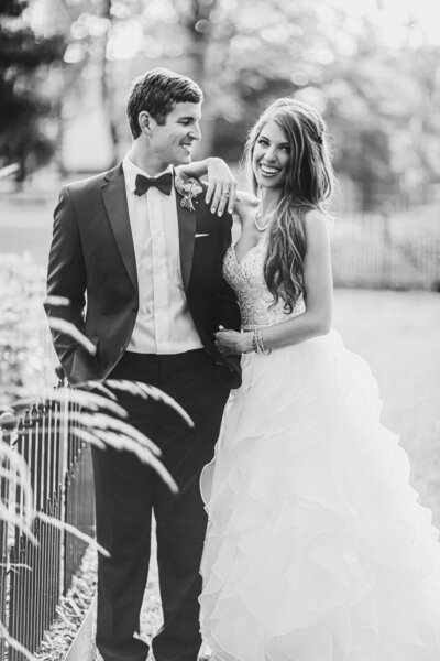 luxury wedding photographer in Northwest Arkansas shoots a close up of a bride and groom in black and white