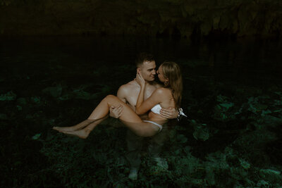 Couple swimming in Dos Ojos Cenote