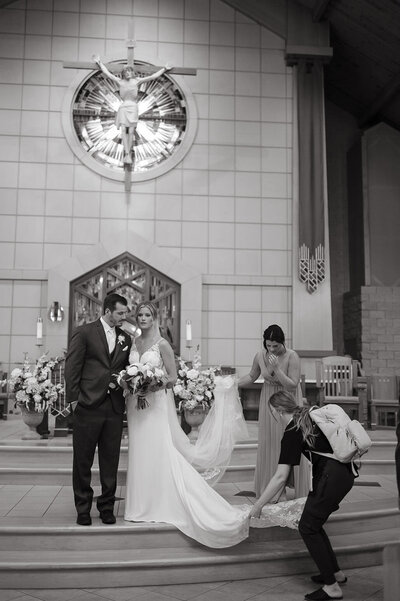 Couple is having their wedding photos at Cathedral of Immaculate Conception in Wichita, Kansas - Ashley Cole Photography