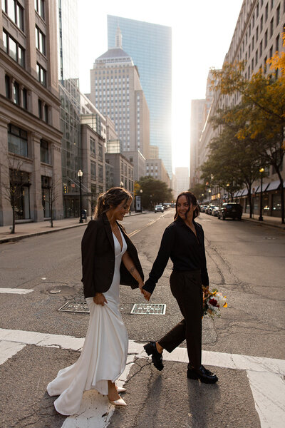 Bride and groom walking  together on the  street