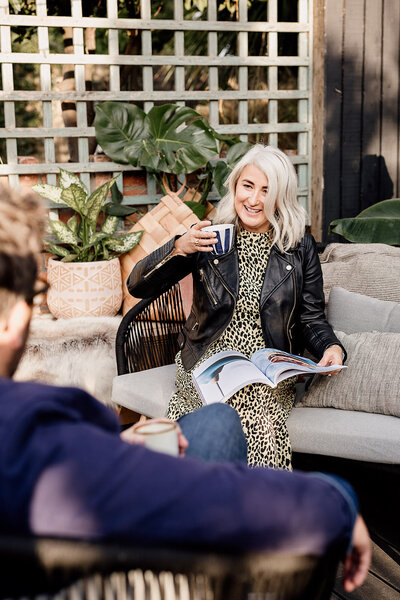 Annie Golledge sat drinking coffee outside her interior design studio in Cardiff