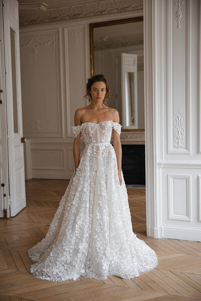 black and white image bride wearing feathered wedding dress