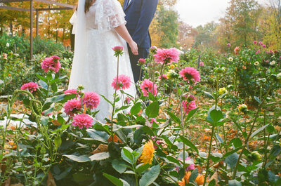Groom spinning bride in a moment of laughter during a candid portrait session