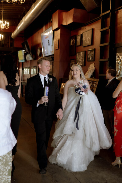 Bride & groom walking together by DFW Wedding Photographer Nicole Endress Photography