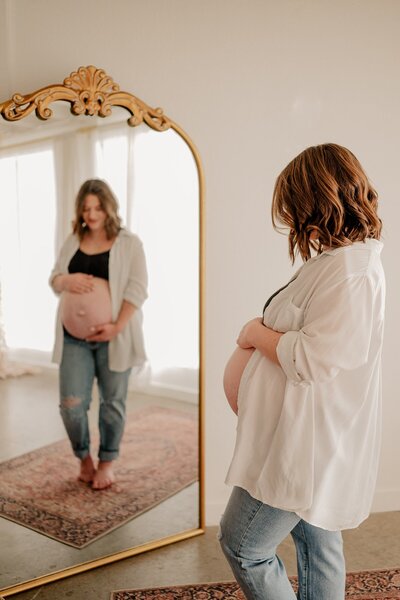 Baby looks at parents in photo taken by Loveland Newborn Photographer