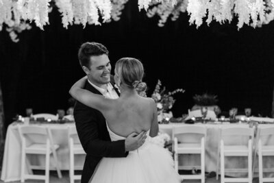 Groom twirling bride during first dance at Howey Mansion wedding