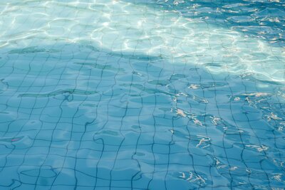 swimming-pool-floor-with-water-ripple-blue-textur-2022-11-16-13-58-55-utc