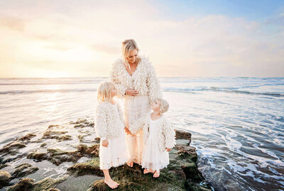 A mom and her two girls on the beach near Rancho Santa Fe by Rancho Santa Fe photographer Tristan Quigley