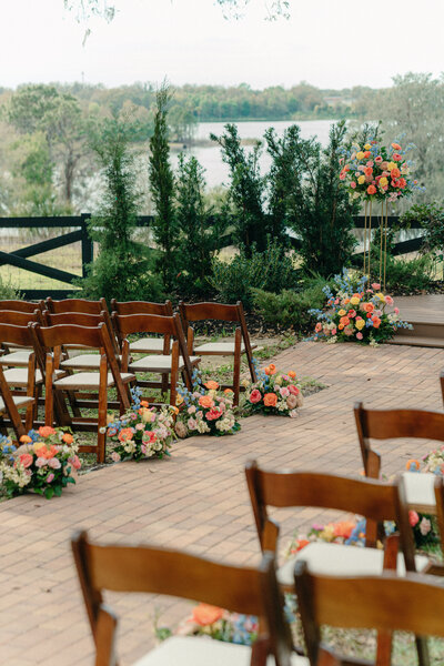 Beautiful floral arrangements adorning a wedding aisle at Lakeview Gardens