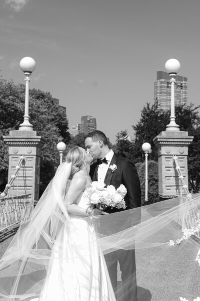 bride and groom about to kiss
