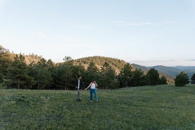 Candid embrace during a sunset engagement session in the Colorado Rockies