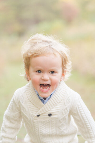 little boy laughing during Northern Virginia fall mini session