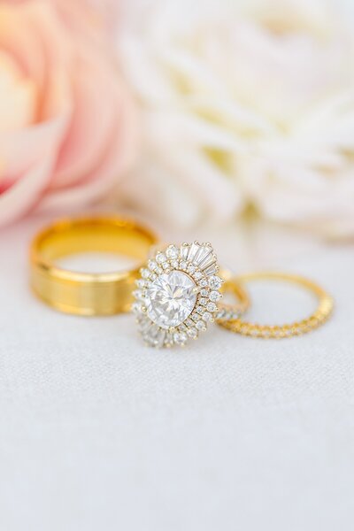 Bride and groom wedding rings at Del Mar Country Club in San Diego, California.