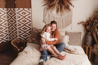 Meet the photographer behind the lenses, Nicole snuggles with her own little ones to give herself a pause button.