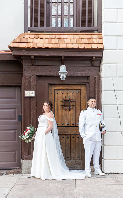 Jacksonville wedding portrait of bride and groom in front of a scenic venue door