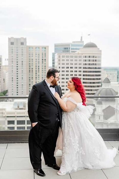fun plus size bride and groom with pink hair