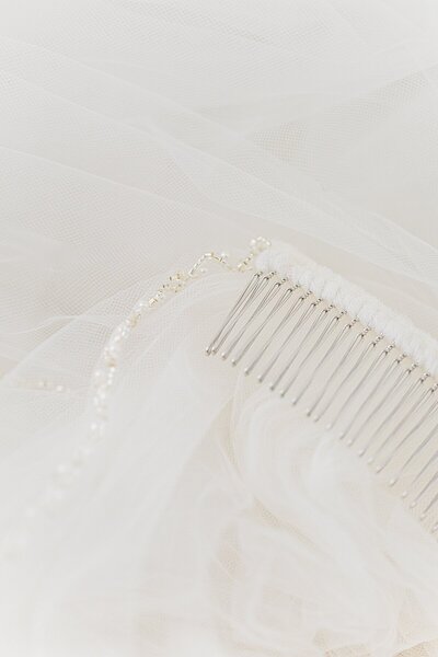 Close up image of bridal veil and hair pin
