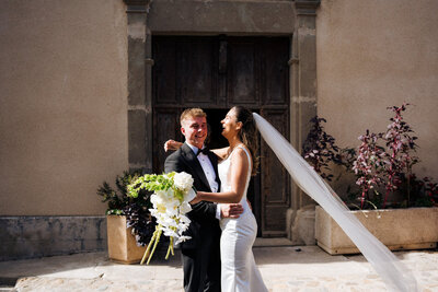 bride-church-exit-white-orchid-wedding-bouquet-france1