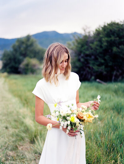 Bride playing with flowers