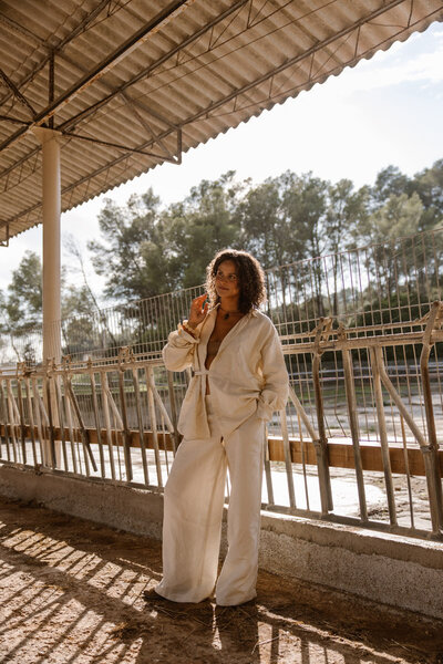 Woman is sitting down and looking back at the camera for a picture