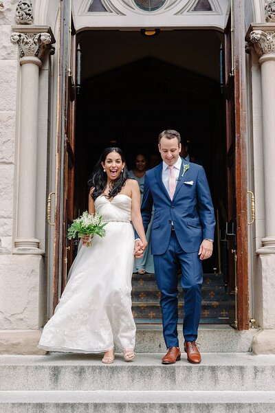 Bride and groom walk up memorial steps at their DC wedding