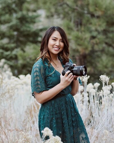 Three16 Photography photographer Kirstin stops during a shoot to smile for the camera