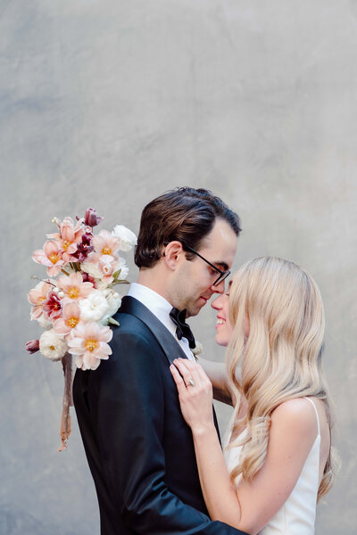 couple poses at hotel emma in San Antonio Texas during their luxury wedding