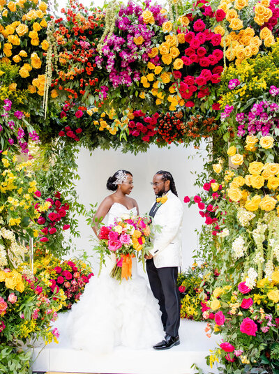 bright florals around couple