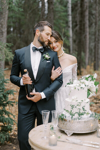 Romantic image of bride and groom on steps of building captured by luxury photographer Revel Photography