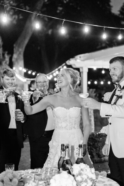 candid photo of bride  & groom running