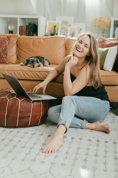 self portrait of nashville photographer posing on a stool with a gray background