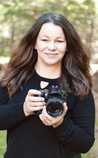 Hudson Valley wedding photographer Agnes J  posing with camera 
