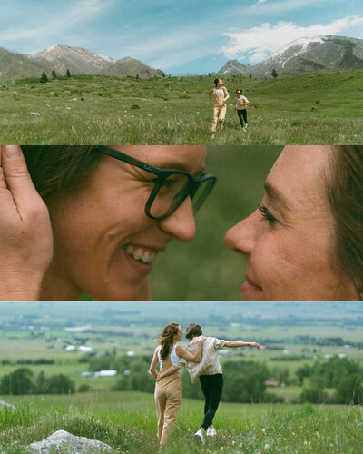 couple walking with mountain range behind them