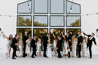 Photo of wedding party standing out on back outside patio at The Eloise