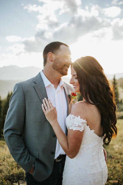 couple holding each other during lake elopement photos in colorado