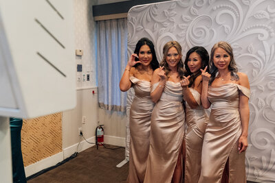 bridesmaids posing for photo booth at a wedding