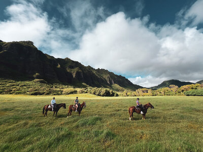 family horseback riding in Jurassic valley in Hawaii