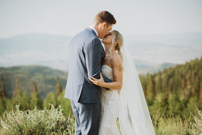 Couple poses for bridals in the mountains in Utah.