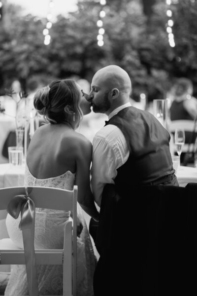 Candid moment of couple during reception toasts