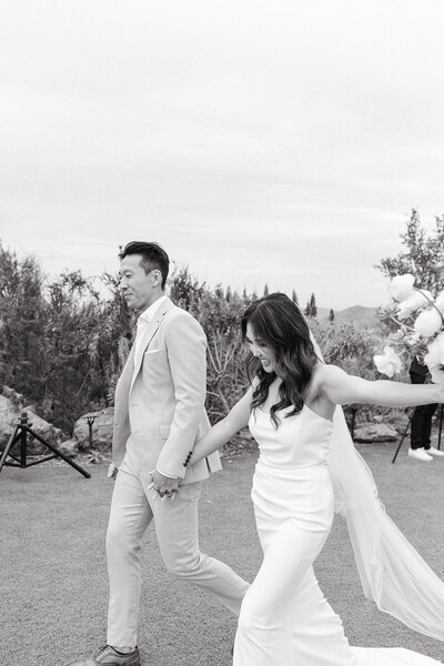 Southern California wedding couple holding hands