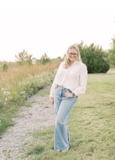 Kelli smiling in a sweater