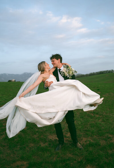 colorado elopement photography at dusk, bride and groom spinning