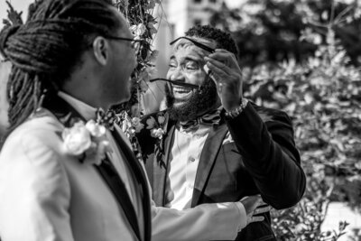 Candid photo of groomsmen crying during wedding ceremony at Shinola Hotel in Detroit Michigan. 