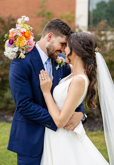 bride and groom embracing intimately